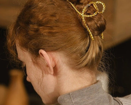 Minimalistische gedraaide lijn grote klauw haarclip