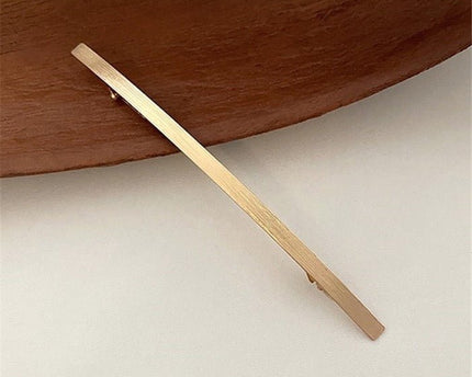Minimalistische metalen haarclip met één regel