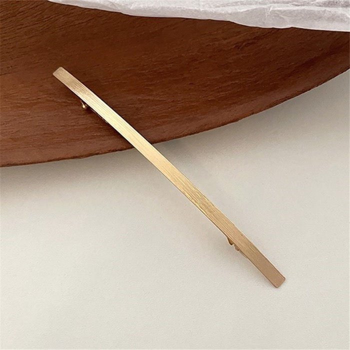 Minimalistische metalen haarclip met één regel