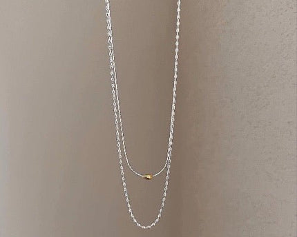 Moderne chique gestapelde kettingen-goud en zilver