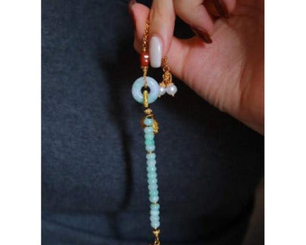 Jade kralen en rode agaat goodluck armband