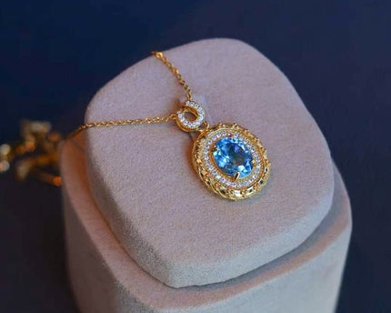 Blauwe Topaas goud ingelijste ovale hanger ketting