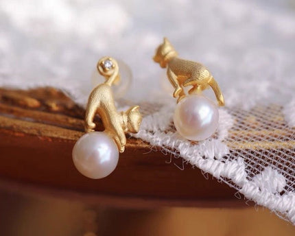 Leuke asymmetrische kattenoorbellen en ketting