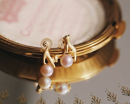 Leuke asymmetrische kattenoorbellen en ketting