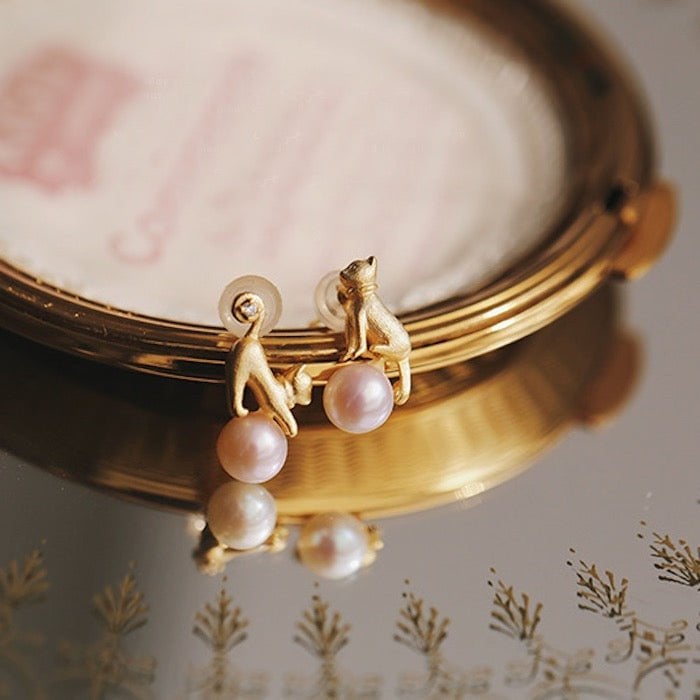 Leuke asymmetrische kattenoorbellen en ketting