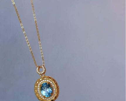 Blauwe Topaas goud ingelijste ovale hanger ketting