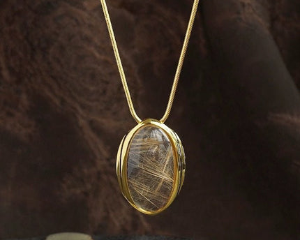 Minimalistisch goud gerutileerde kwarts ovale hanger ketting
