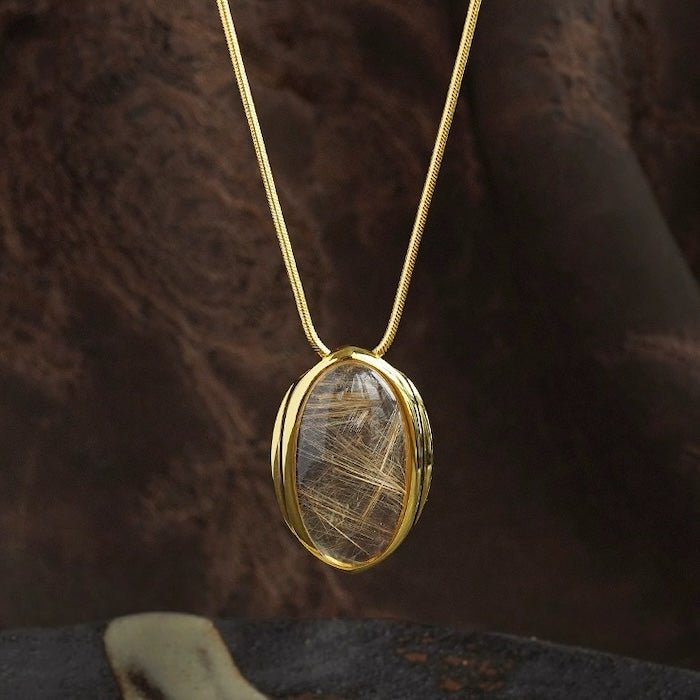 Minimalistisch goud gerutileerde kwarts ovale hanger ketting