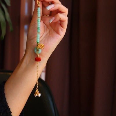 Jade kralen en rode agaat goodluck armband