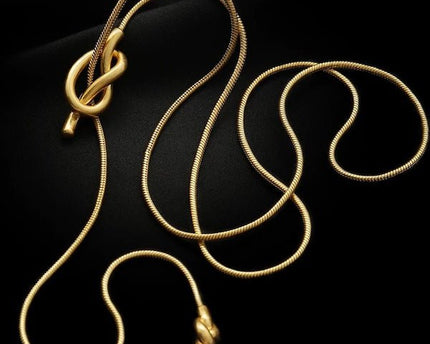 Minimalistische lange trui ketting met knoop