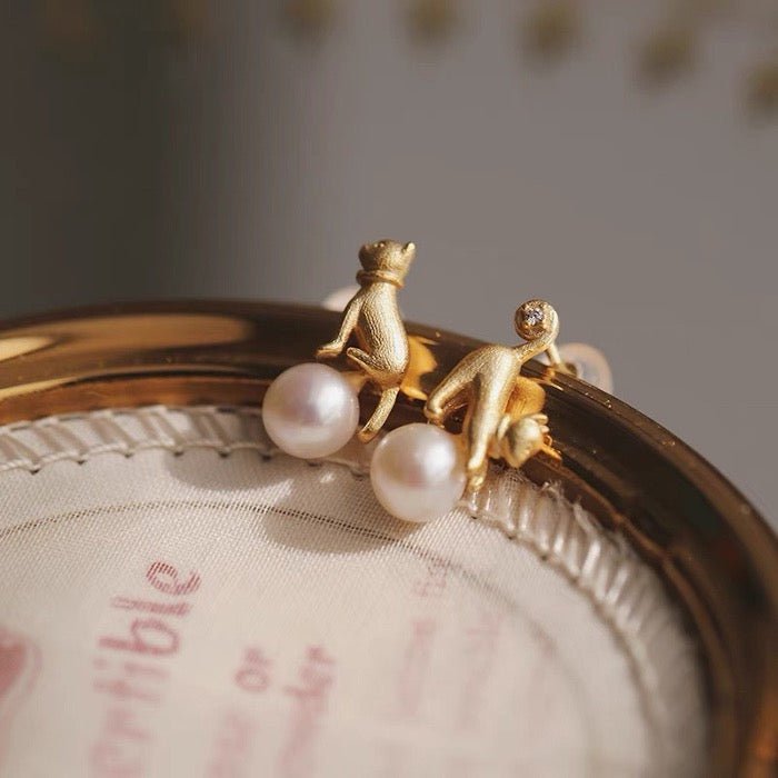 Leuke asymmetrische kattenoorbellen en ketting