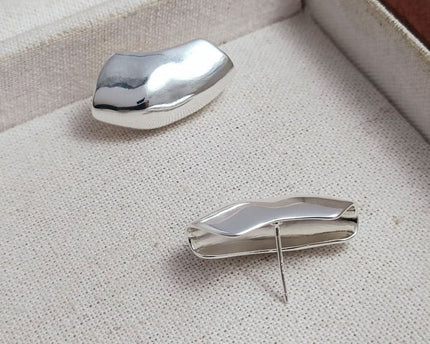 Unieke zilveren Armor Wrap oorbellen
