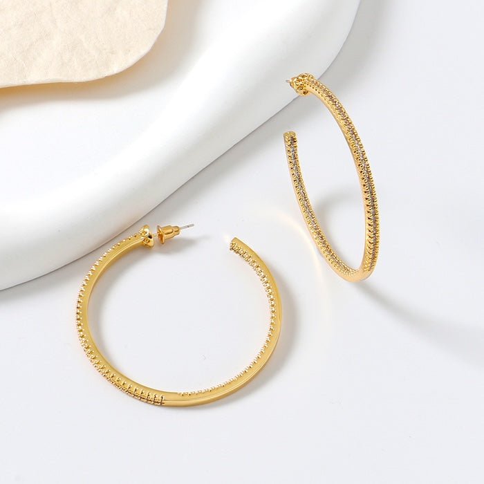 Oversized sprankelende hoepeloorbellen - 360 graden glamour