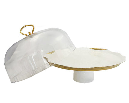 Witte porselein cake bel gouden randen met taartschop