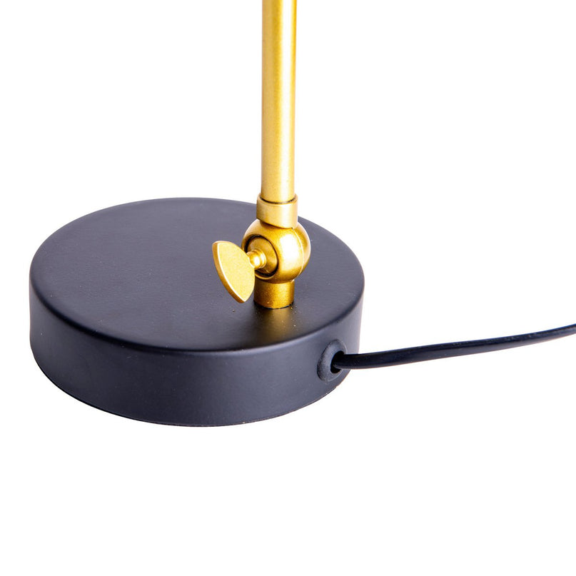 De "Triton" tafellamp gemaakt van zwart en messing gekleurd metaal is 42,5 cm hoog, heeft een E14-versie en is ideaal voor woonkamer, gang, kantoor of dessert