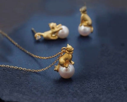 Leuke asymmetrische kattenoorbellen en ketting