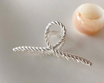 Minimalistische gedraaide lijn grote klauw haarclip