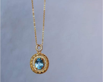Blauwe Topaas goud ingelijste ovale hanger ketting