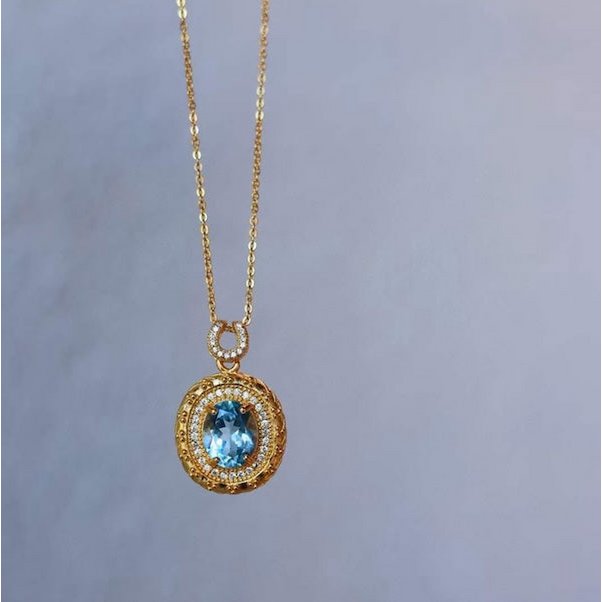 Blauwe Topaas goud ingelijste ovale hanger ketting