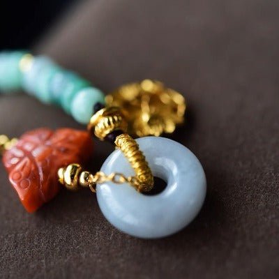 Jade kralen en rode agaat goodluck armband