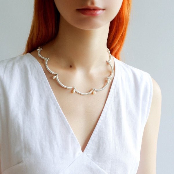 Elegante kanten bloemversiering parelketting