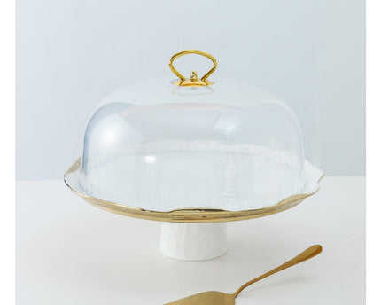 Witte porselein cake bel gouden randen met taartschop