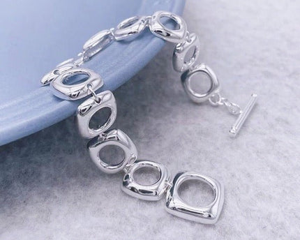 Stevige sterlingzilveren armband met gedurfde look en vierkante frameschakels met OT-gesp