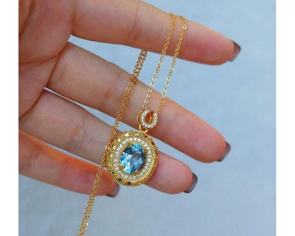 Blauwe Topaas goud ingelijste ovale hanger ketting
