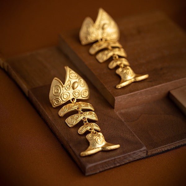 Dikke visgraat statement oorbellen